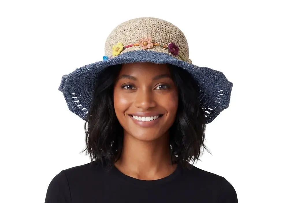 Thumbnail: Model in sun hat with natural hemp colour crown & blue brim with hatband of multi-colour flowers