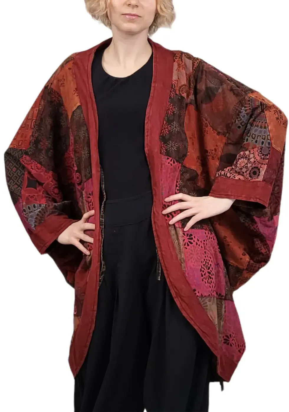 Thumbnail: Front view of model in cocoon shaped kimono style long jacket of burgundy patchwork with long sleeves