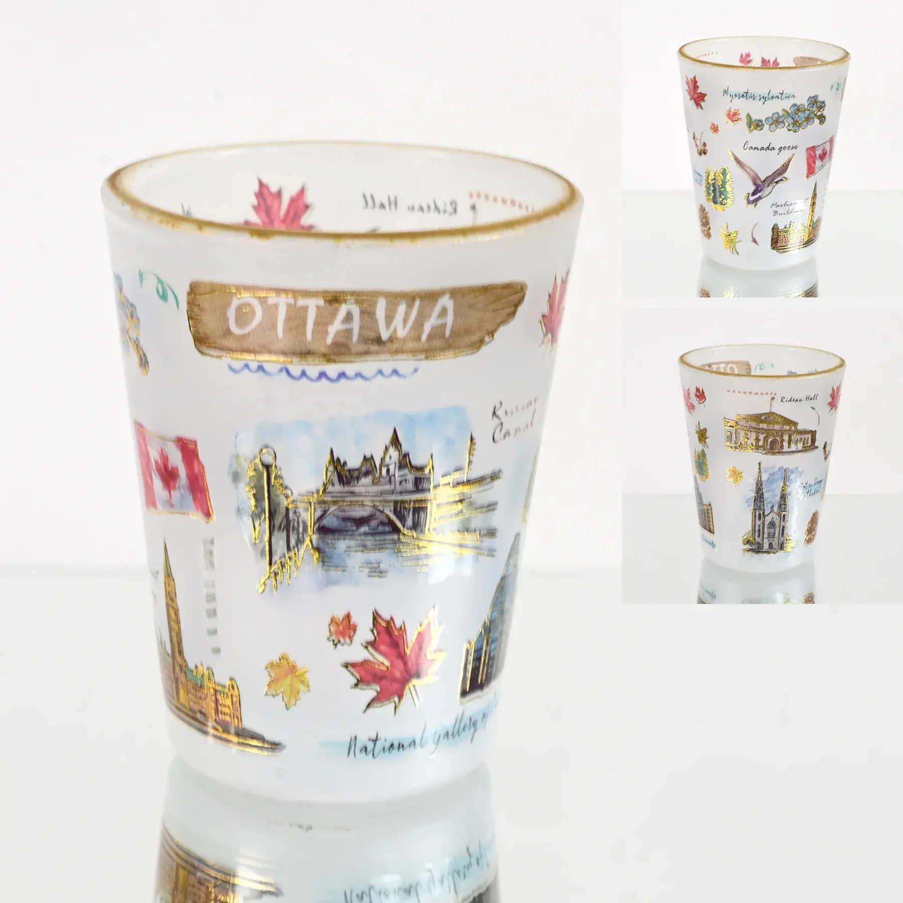A frosted Ottawa landmarks shot glass with gold trim and colorful illustrations at Tickled Pink Ottawa.