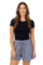 Front view of model in grey elastic wait drawstring shorts with side pockets