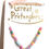 Thumbnail: Child's dress-up necklace of multi-colored pastel beads with enamel rainbow pendant on card