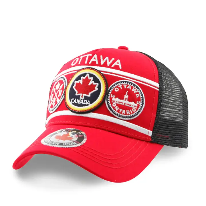 Front left view of red trucker hat with 4 embroidered patches on front