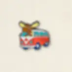 Humorous enamel pin of a moose driving a tour bus at Tickled Pink Ottawa.