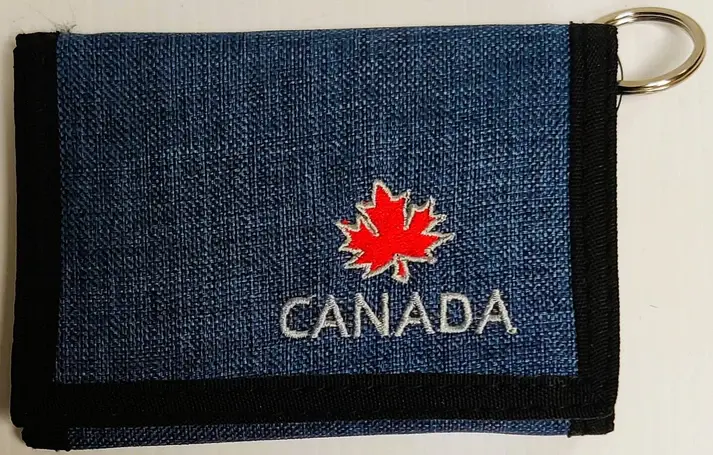 Blue fabric folded wallet with red maple leaf & 'Canada' embroidered in white
