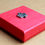 Thumbnail: Red box with small pewter maple leaf at center of lid