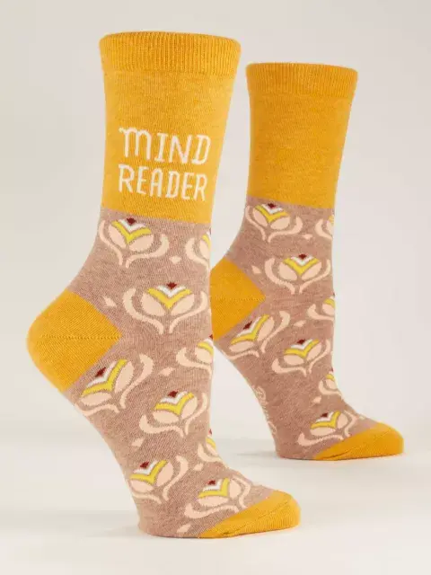 Side view of pair of yellow socks with tan & beige print, text, 'Mind Reader'