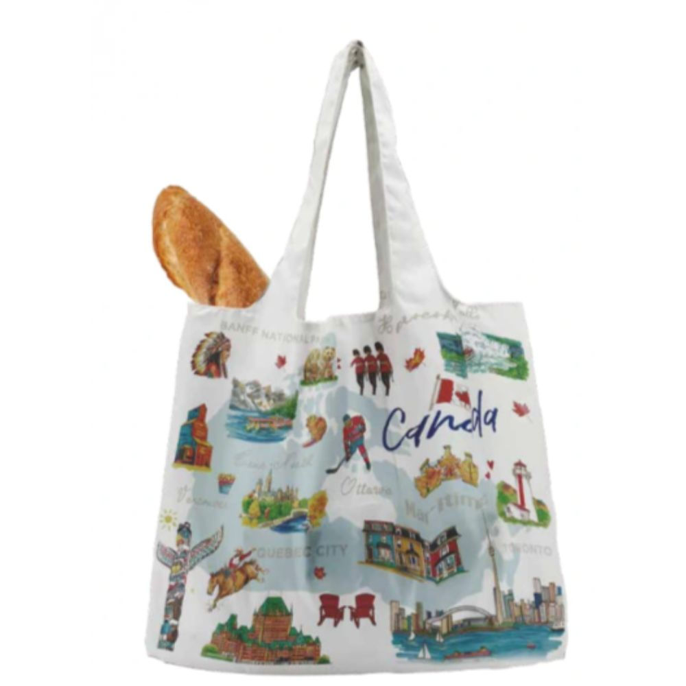 Tickled Pink's white foldable tote bag featuring a colourful print of Canadian icons with a baguette peeking out.