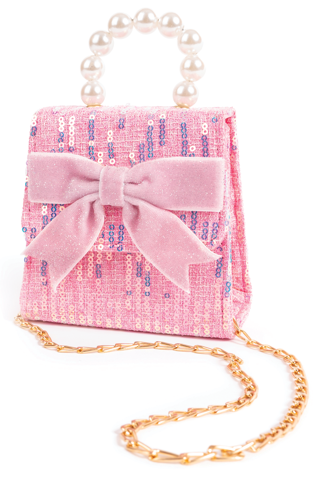 A pink sequinned mini purse with a large pink bow, pearl handle, and gold crossbody chain displayed at Tickled Pink.