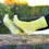 Thumbnail: Model's feet on log by lake wearing yellow socks with lighter heel & toe