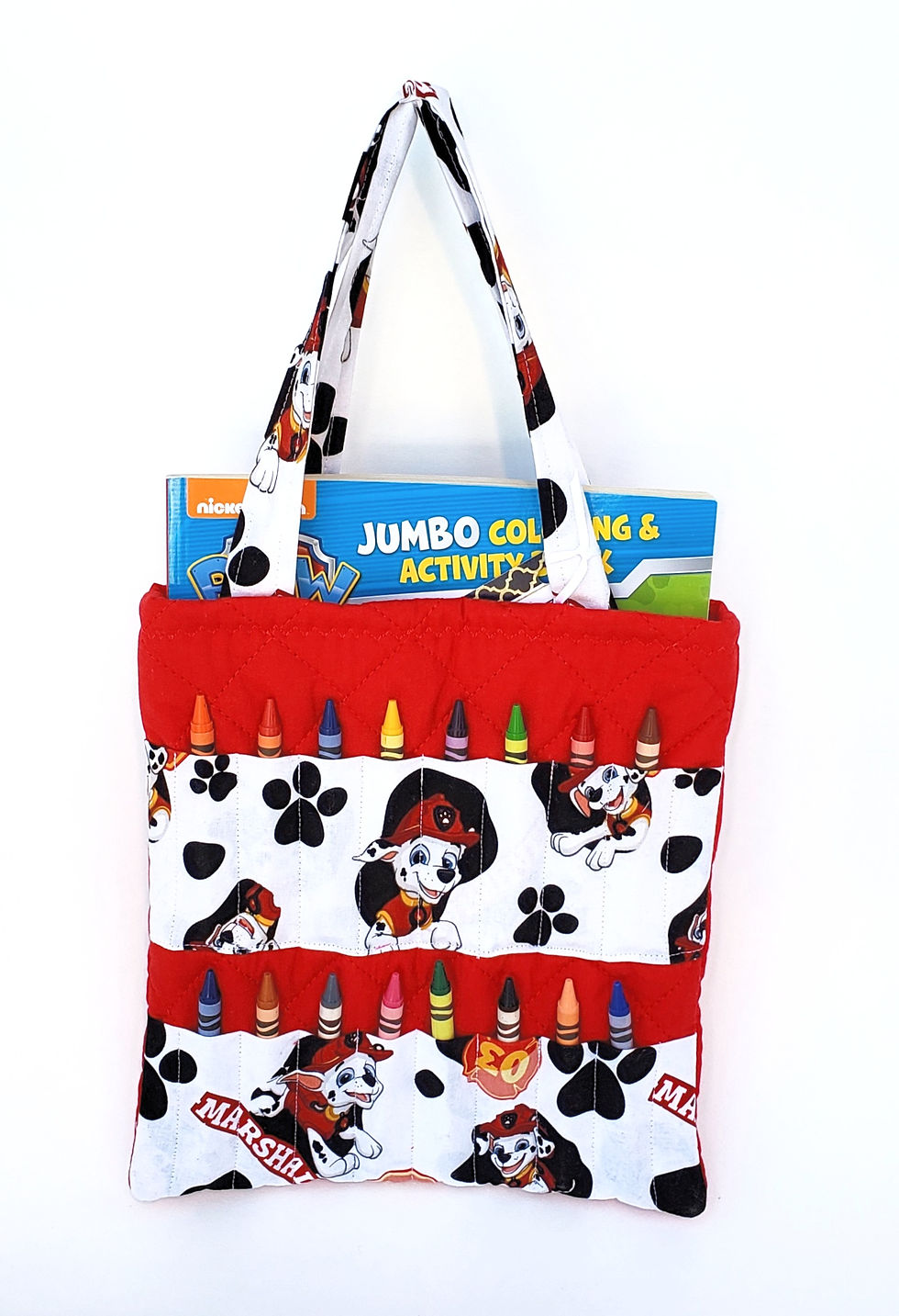 Thumbnail: A handcrafted fabric crayon activity bag with crayons and a colouring book at Tickled Pink Ottawa.