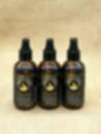 Exquisite warm orchid 4oz bundle with two amber oil bottles and one body spray mist on rustic burlap