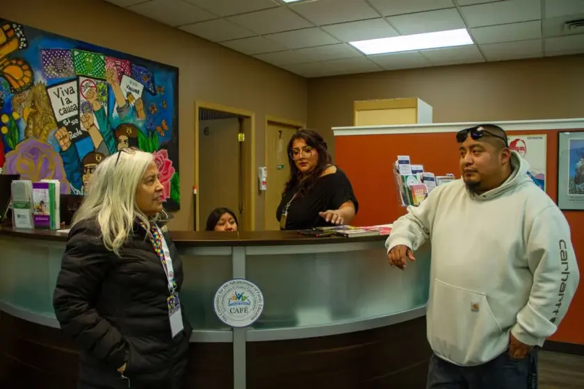 From left, CAFÉ co-founder Alma Chacón, Ana Sanchez, Mona Lopez and Francisco Jimenez stand at the front desk on Friday, Dec. 12 2025. CAFÉ moved to the former Chelan-Douglas Community Action Council building.