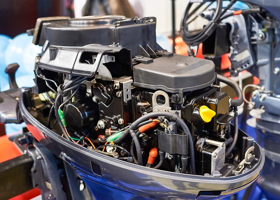 Close-up of a marine boat engine with the cover removed.