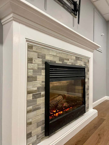 Closeup view of fireplace with stone facade