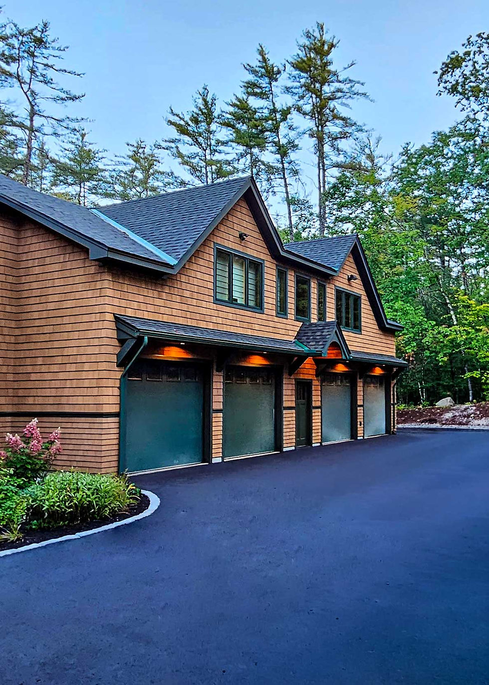 Exterior view of custom Madison, NH home garage and driveway