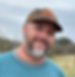 Josh Miller standing in a field in Alabama.