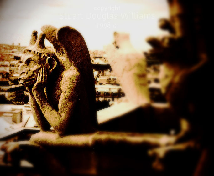 Ennui, 1998. Best travel photography Europe by Stuart Douglas Williams. Le Stryge, unimpressed, surveys the hustle and bustle below the Cathedral of Notre Dame, Paris.