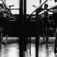Girls Lacing Up Their Ballet Shoes