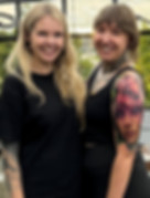 Ashley Casavant with tattoo artist, Sandra Daukshta, smiling with their tattoos. Ash & Ink Tattoo, Kelowna