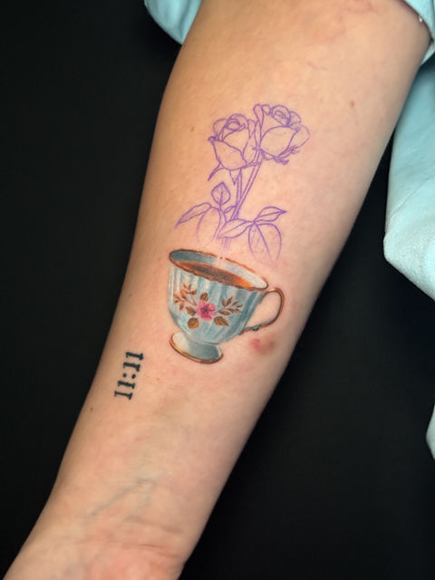 Work in progress tattoo in Kelowna. Realistic teacup as a flower pot on the inner forearm.