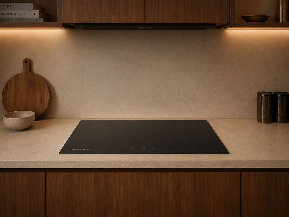 Flush black induction cooktop set into a stone countertop in a warm minimalist kitchen with wood cabinetry and soft under-cabinet lighting.
