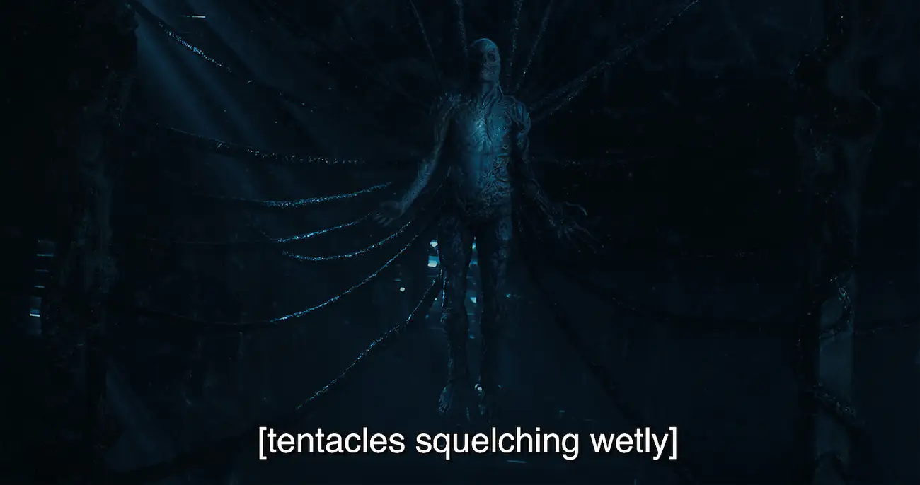 Example of captions used in "Stranger Things." Screenshot from the movie with the subtitles, "[tentacles squelching wetly]"