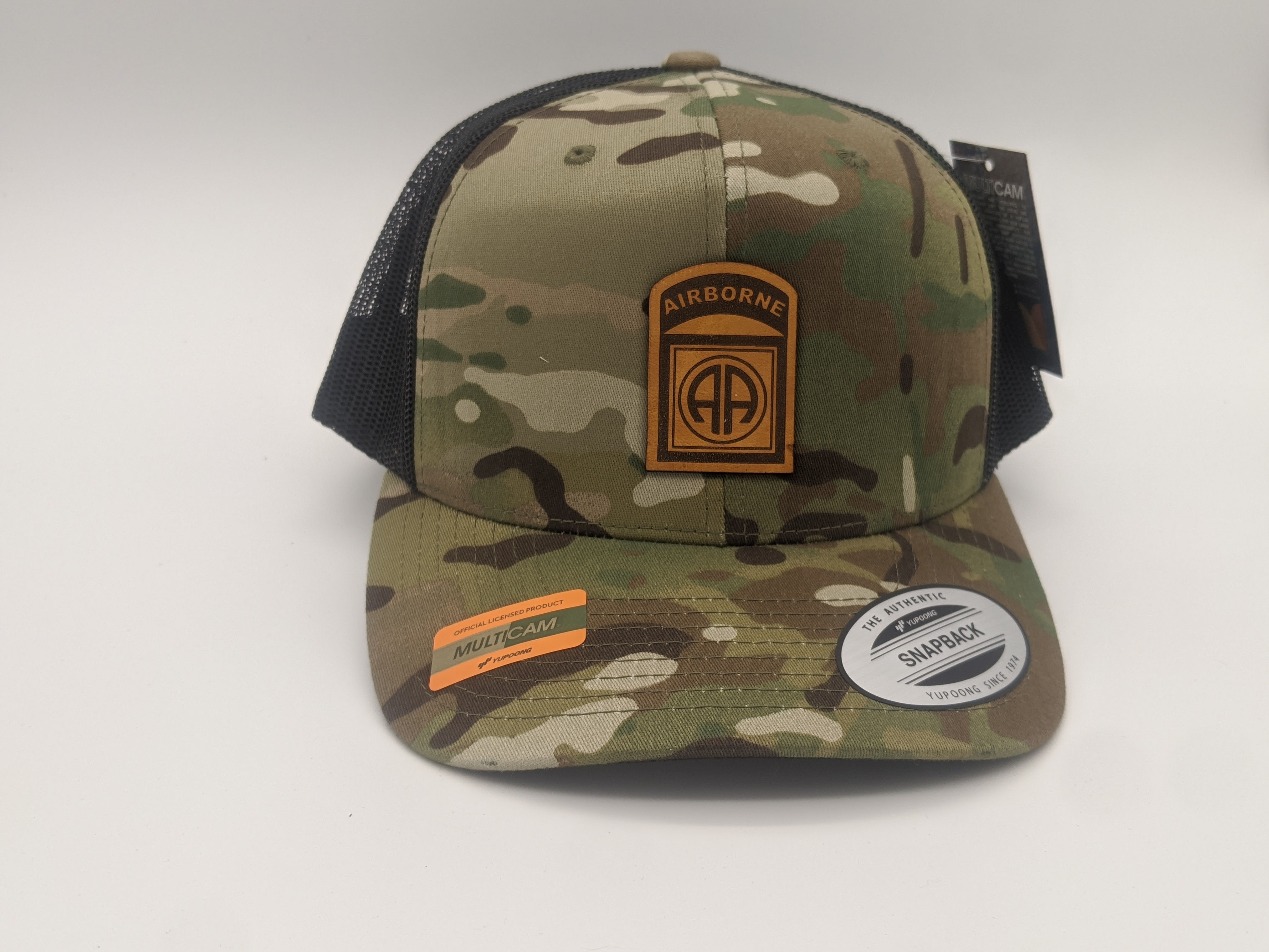 82nd Airborne unit patch on multi camo hat