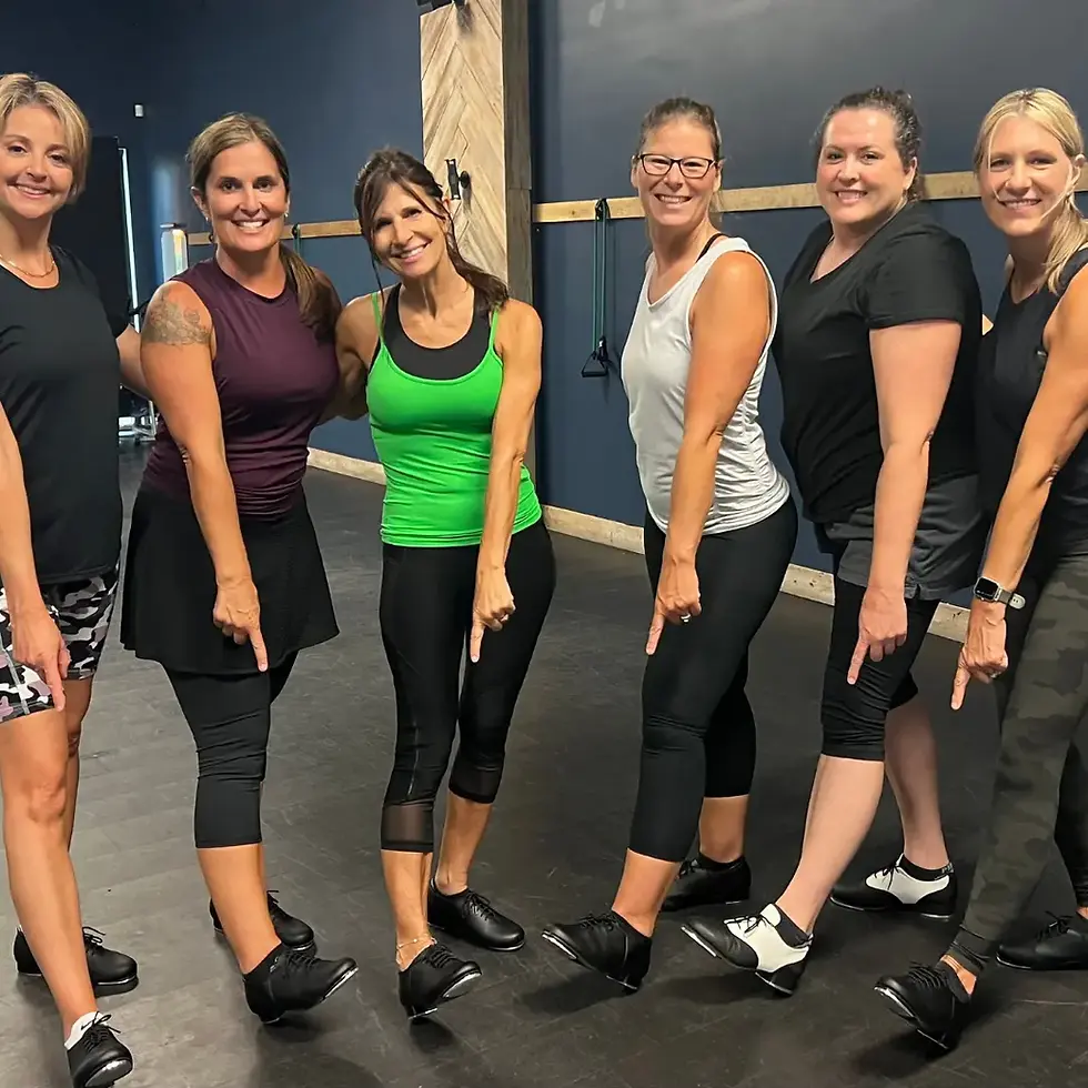 Adult women in tap shoes smiling during dance class in Bradenton
