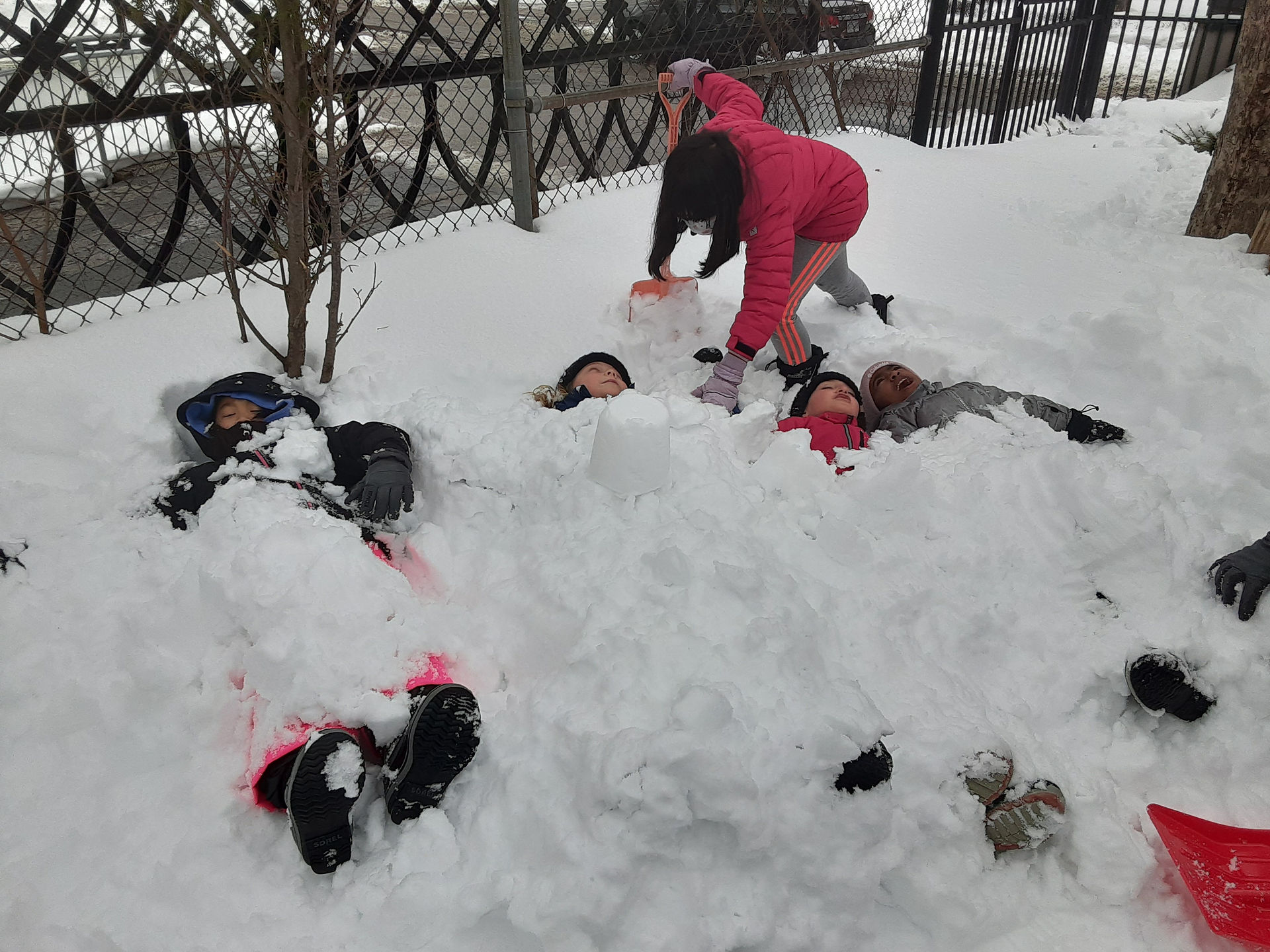 children burried in snow