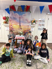 children posing in a photo booth set up for La Semaine de la Francophonie