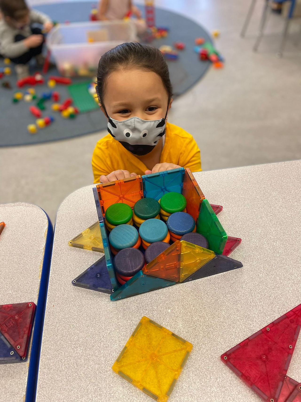 child playing with manipulatives