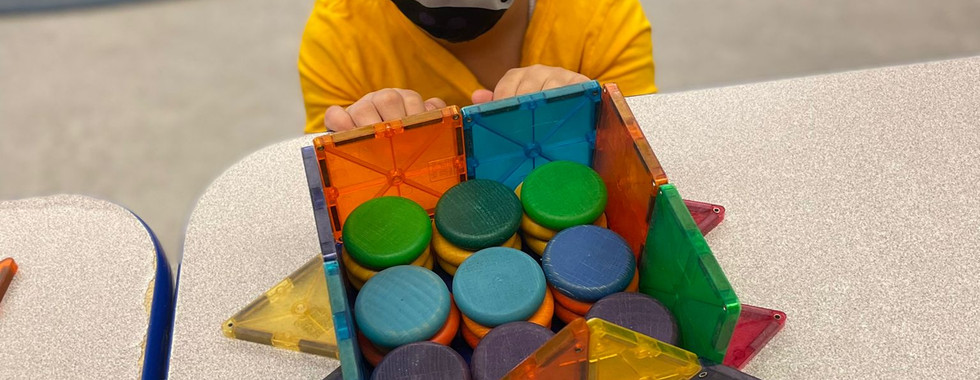 child playing with manipulatives