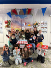 children posing in a photo booth set up for La Semaine de la Francophonie