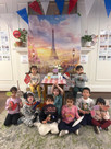 children posing in a photo booth set up for La Semaine de la Francophonie