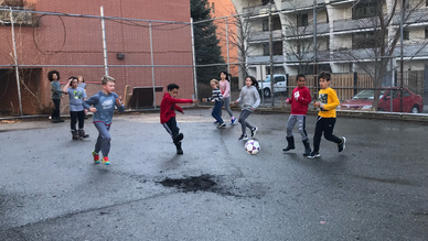 children playing soccer