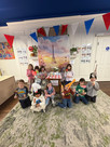 children posing in a photo booth set up for La Semaine de la Francophonie