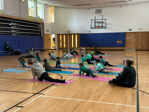 Students doing a yoga pose in unison