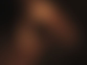 Silhouette of a human head formed by swirling orange flames on a dark background, creating an ethereal and intense atmosphere.