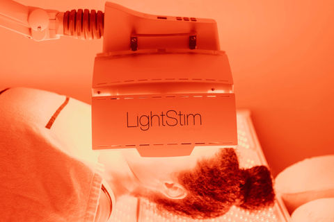 LightStim LED therapy bed at Buddha Bella Healing Center in Phoenix, a calming wellness space designed for red light therapy to support recovery, skin health, and overall relaxation.