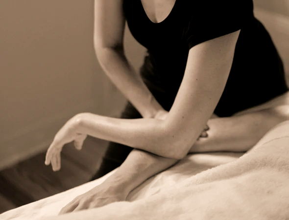 Hands gently holding a small rock, symbolizing focus, care, and the protective aspects of hand therapy or self-preservation.