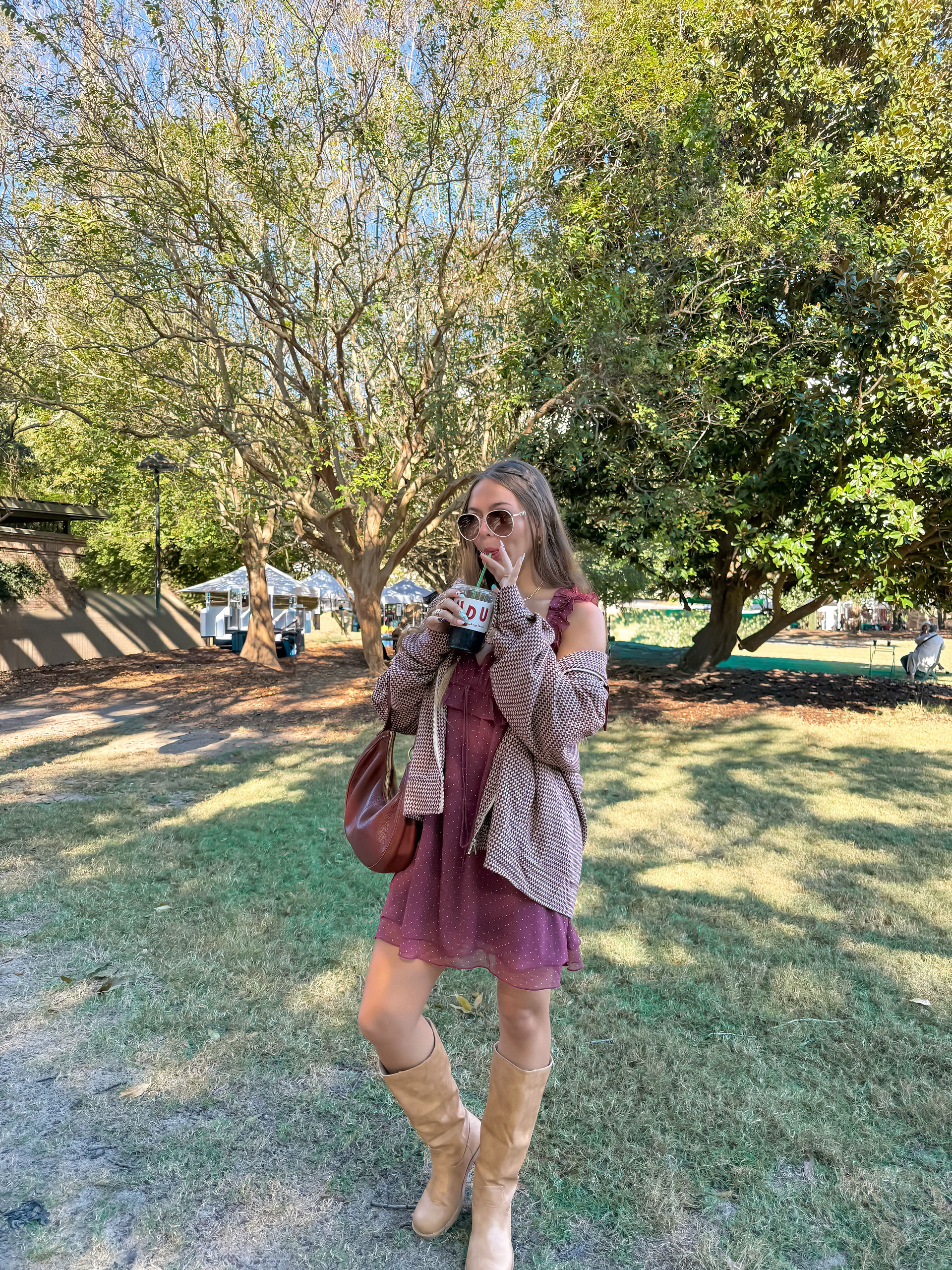 a girl drinking a cold brew at a farmer's market