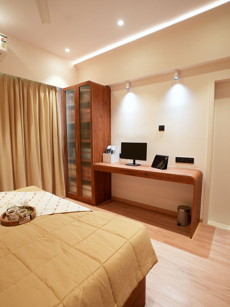 Full view of a Parel master bedroom with a customised storage bed and waterfall desk.