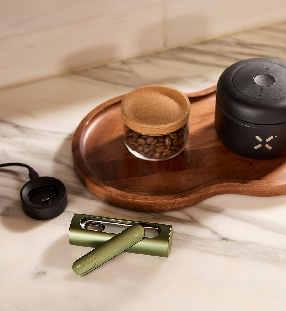 PAX vaporizer with accessories on tray beside coffee beans, emphasizing compact design, easy use and everyday convenience