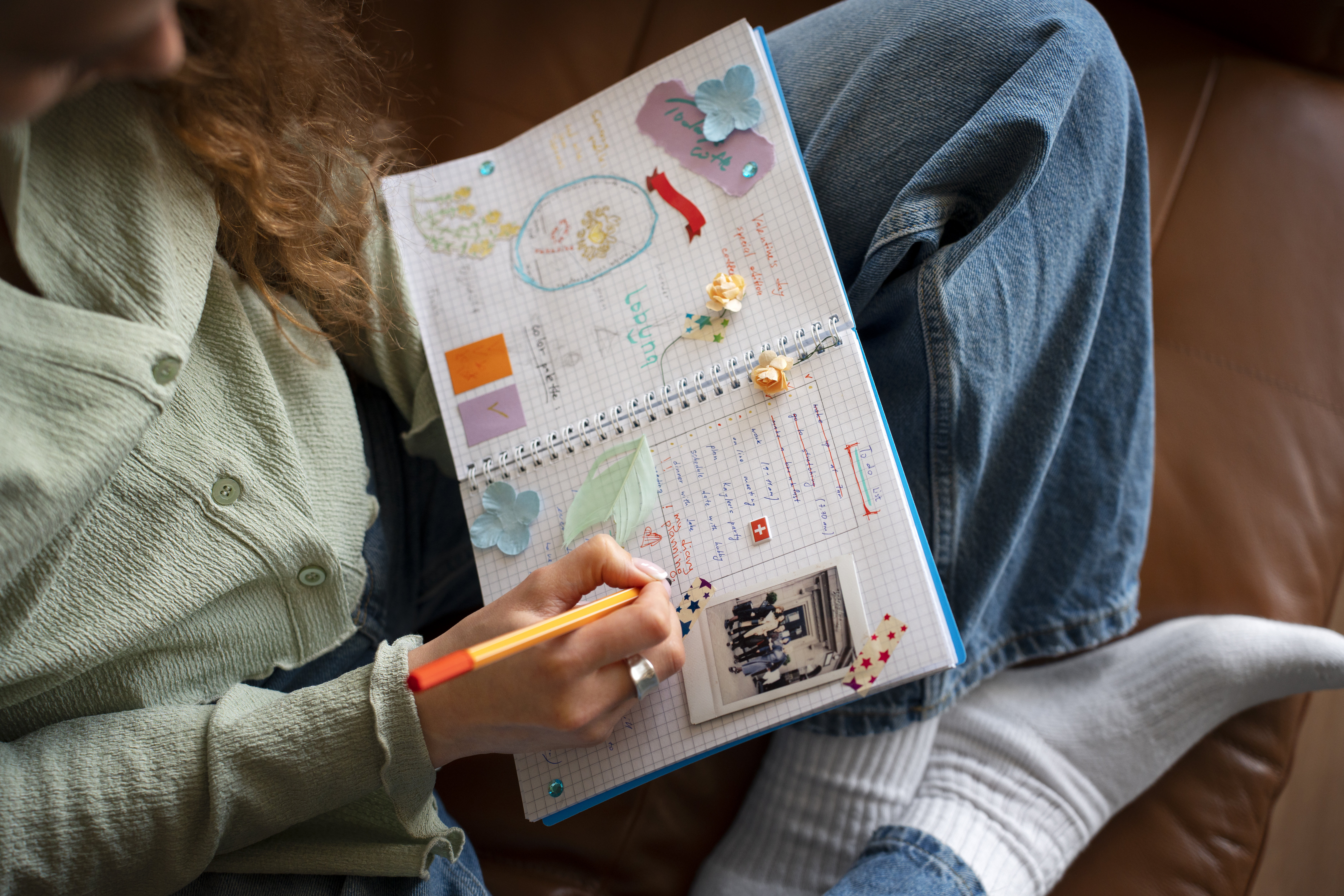 high-angle-woman-doing-creative-journaling