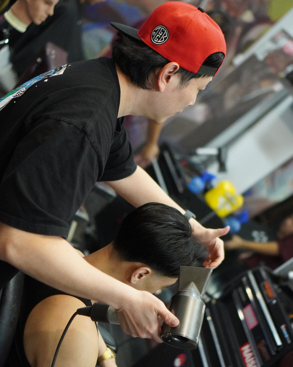 Barbers at work inside The Good Guys Barber