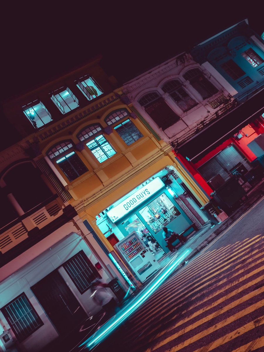 The Good Guys Barber shopfront glowing on Rowell Road at night
