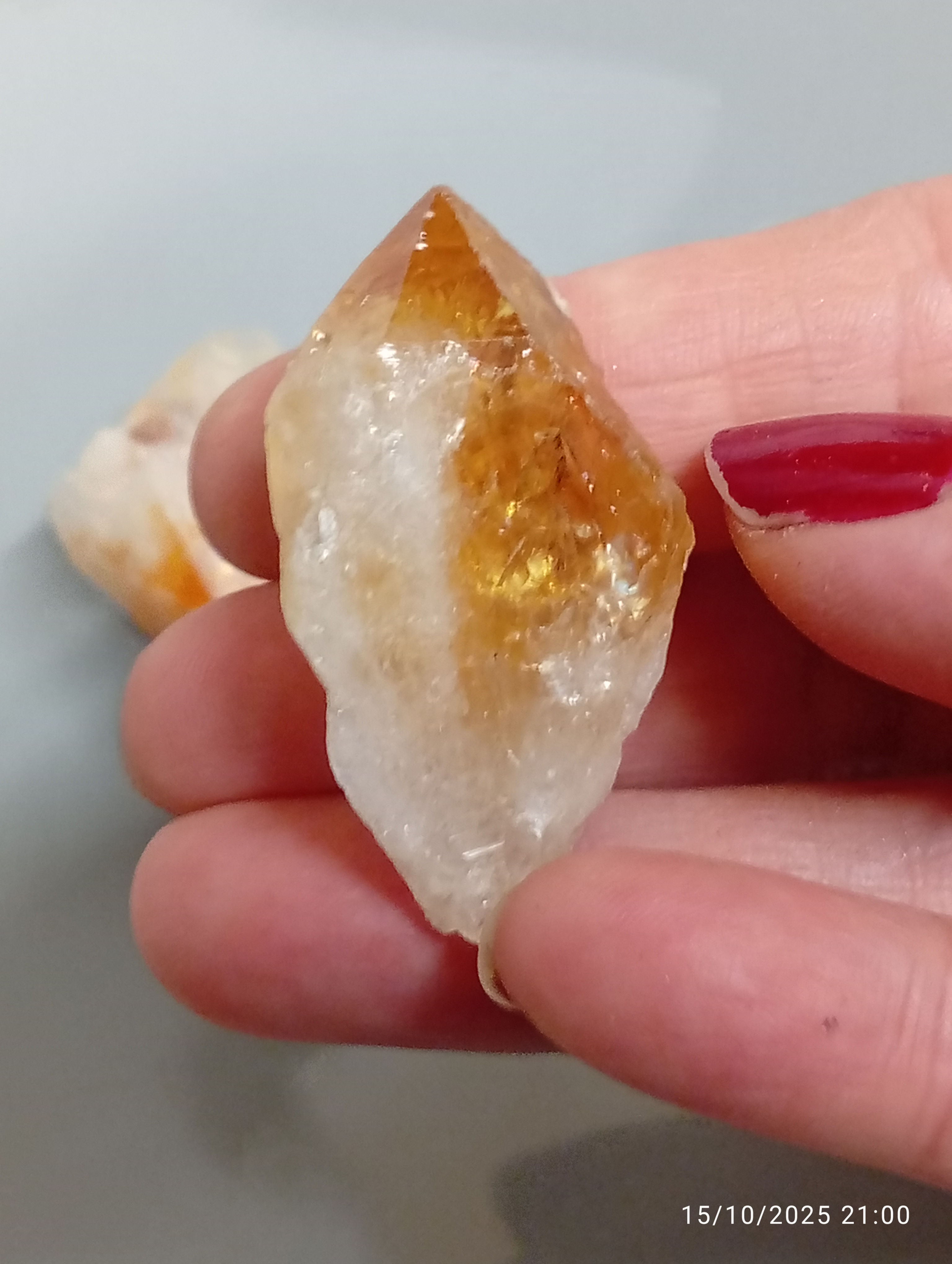 4 pieces of orange-to-yellow citrine points, these are heated amethyst.