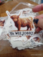 Highland cow sticker with phrase "Ya Wee Jobby"