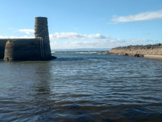 The view of the harbour gates at Dunure.