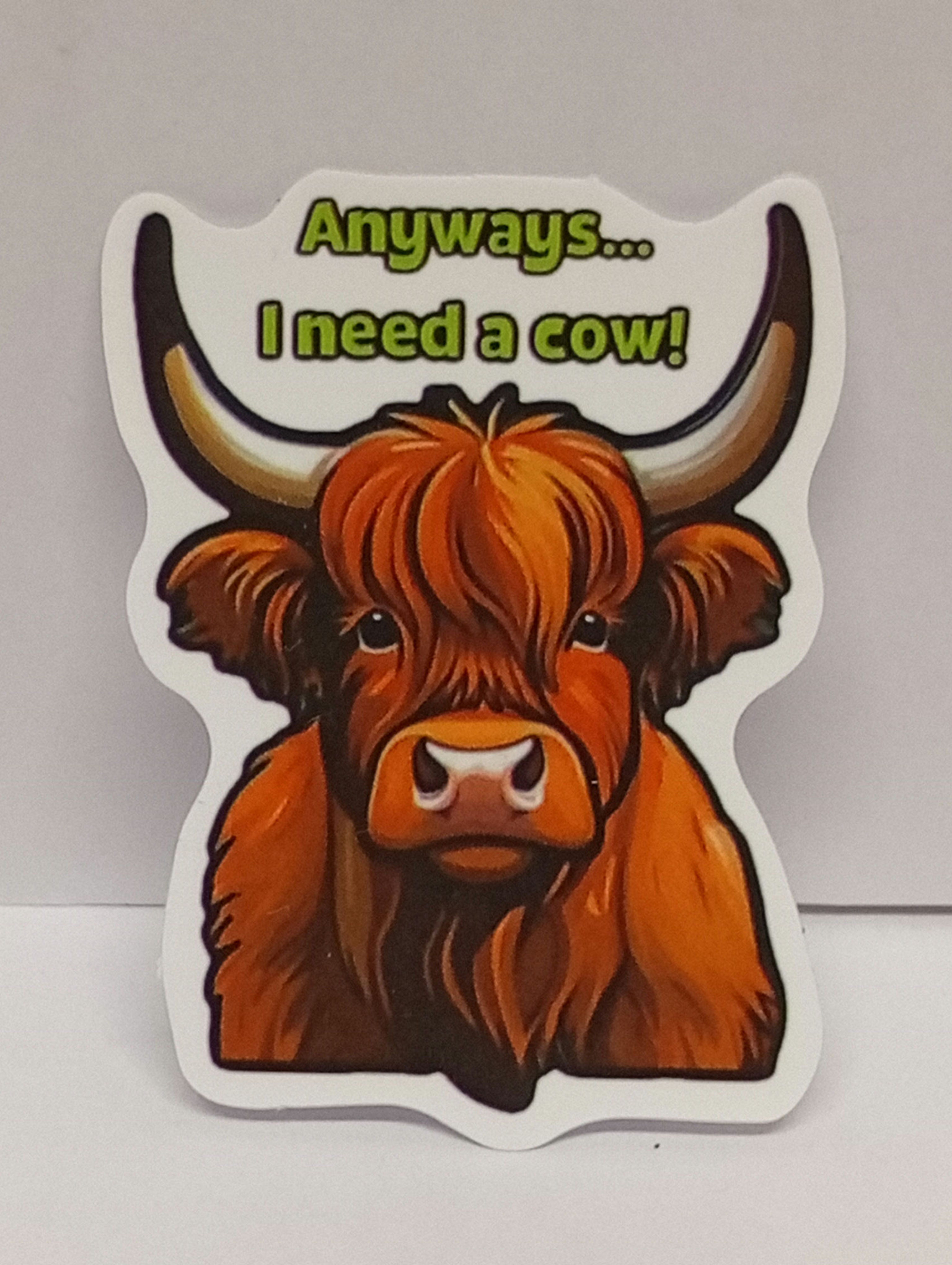 A highland cow sticker with the words "Anyways... I need a cow""